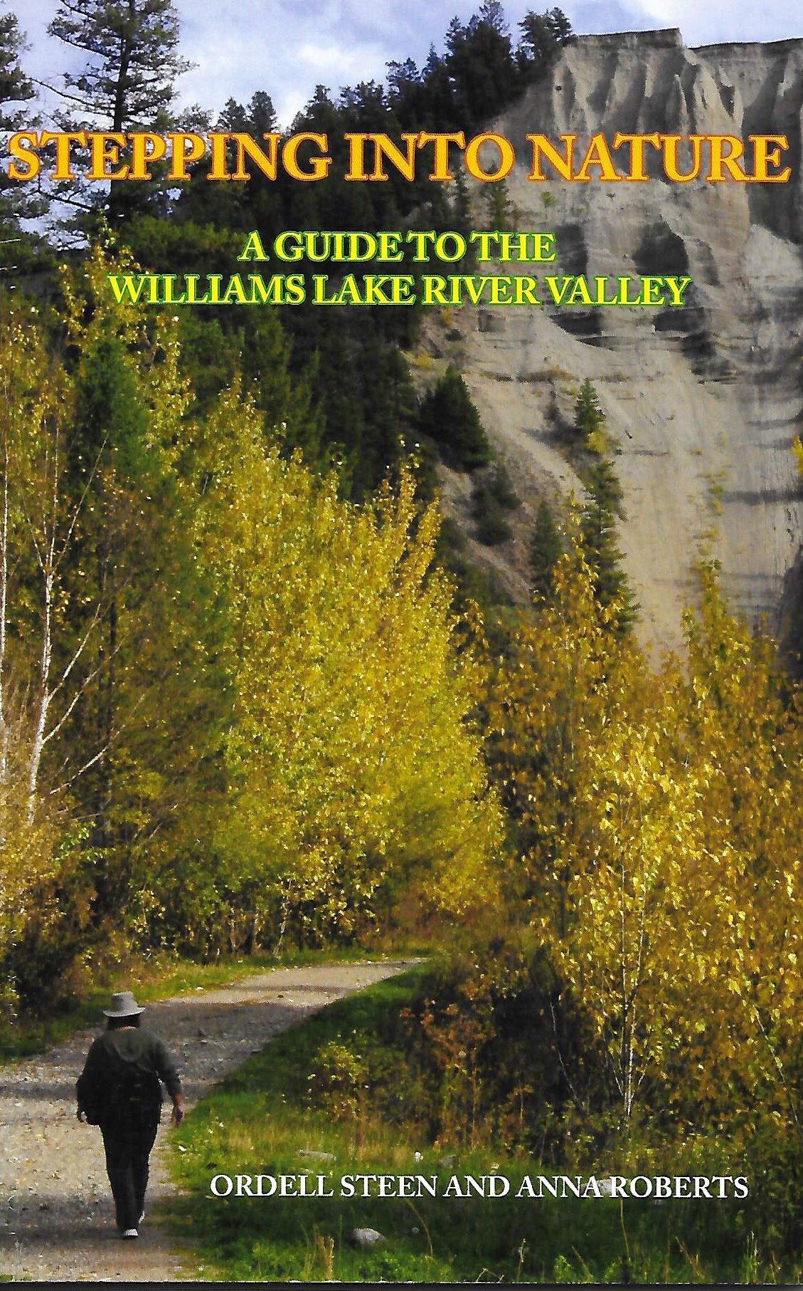 Book cover for "Stepping into Nature: A Guide to the Williams Lake River Valley". A person walks down a gravel path in the river valley flanked by broad leaf trees turning yellow at the start of fall and a sandy cliff ahead.